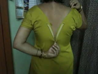 indian aunty taking her shirt off in bedroom
